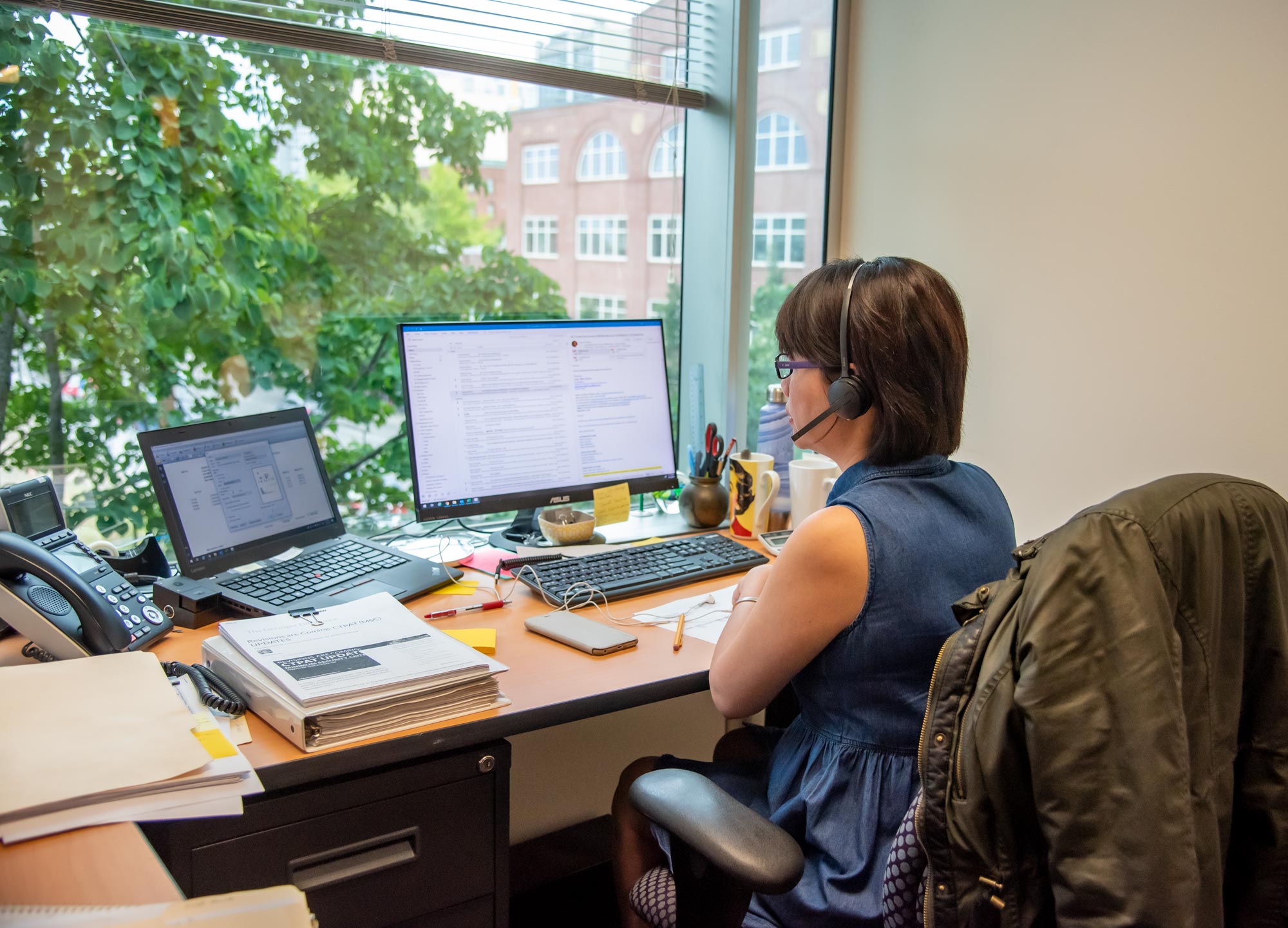 Customer Service - Woman at desk with headset